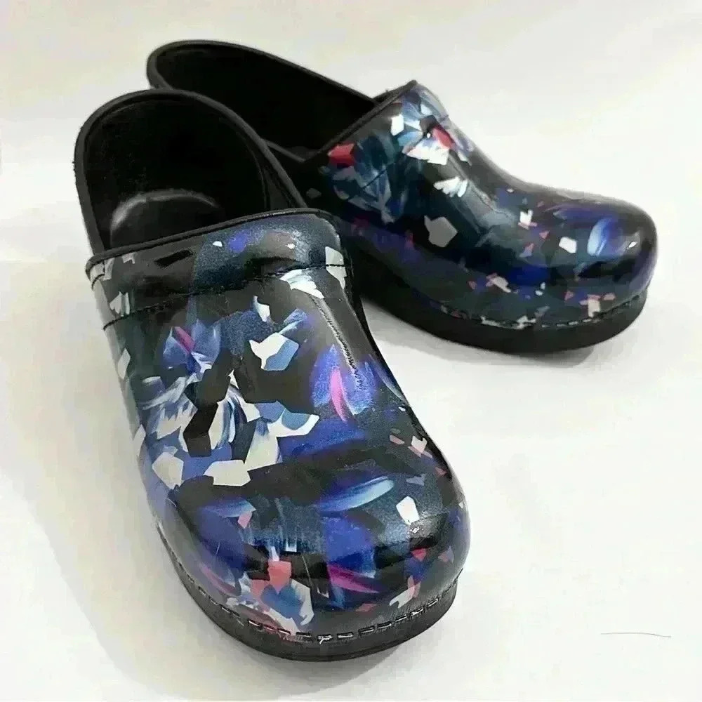 Dansko Floral Confetti Patent Leather Clogs in Black and Blue